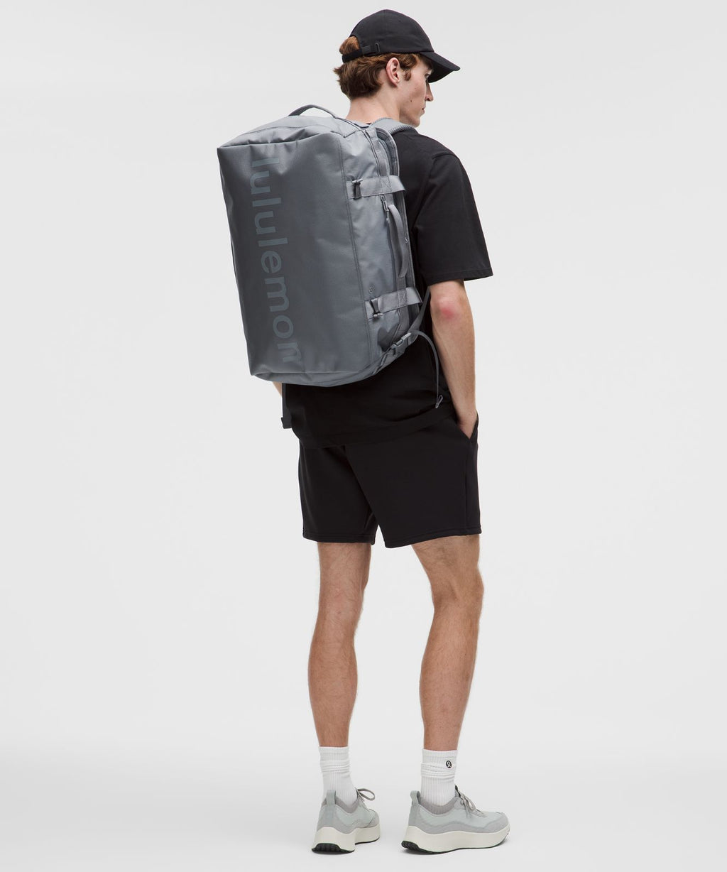 2-in-1 Travel Duffle Backpack 45L Solar Grey/Detours Welcome Emboss Black