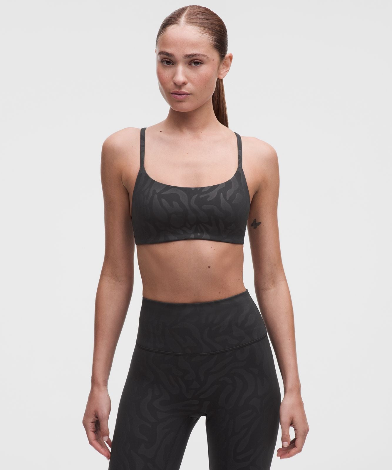 Wunder Train Strappy Racer Bra *Light Support, A/B Cup Zebra Camo Emboss Black
