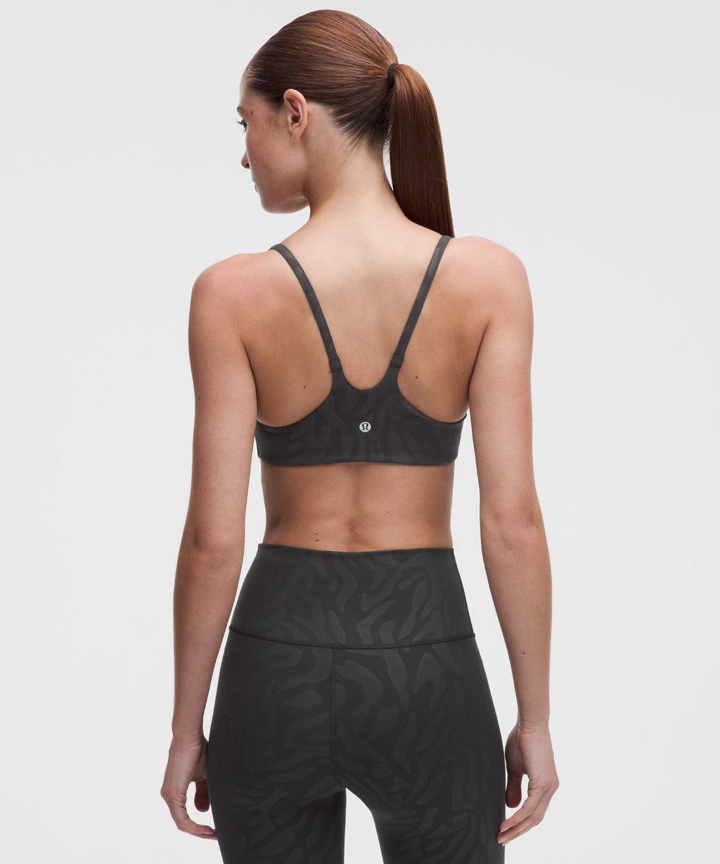 Wunder Train Strappy Racer Bra *Light Support, A/B Cup Zebra Camo Emboss Black